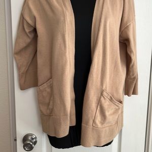 Cardigan Sweater.  3/4 sleeves and pockets.  Open, no buttons.